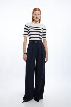 Experience Elevated Tailoring In A Pair Of Wide Leg Trousers, With A Flattering, Relaxed Fit And A Comfortable High Waistline. The Sleek Design Makes Them Easy To Style With Anything, From A Button Up Shirt For A Formal Look, Or With A T-Shirt And Trainers For A More Laid Back Approach. Compact Stretch Essential Tailored High Waist Wide Leg Trousers High Quality Stretch Fabic Comfortable High Waistline Flattering Wide Leg Fit Pocket Accents Sleek, Minimal Design High Waisted Trousers Outfit Casual, Women Tailored Pants, Shirt With Trousers Women, Tailored Wide-leg Office Bottoms, Wide Leg Navy Pants Outfit, Womens Trousers Outfits, Navy Wide Leg Trousers Outfit, Navy Wide Leg Pants Outfit, Navy Casual High-waisted Wide Leg Pants