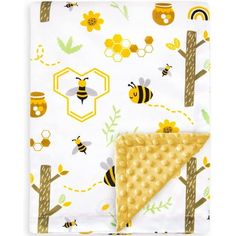 a blanket with bees and honeycombs on it