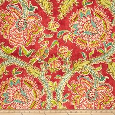 a red and green floral pattern on fabric with a ruler in the foreground,