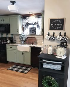 the kitchen is clean and ready to be used for cooking or baking, while also being decorated with black and white checkered decor