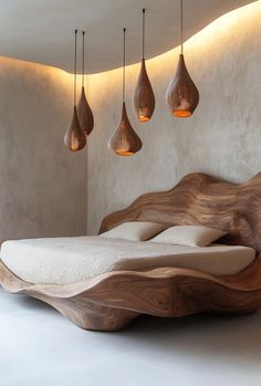 a bed with wooden headboard and lights hanging from the ceiling in a modern bedroom