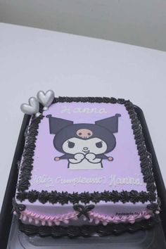 a square cake decorated with an image of a cat