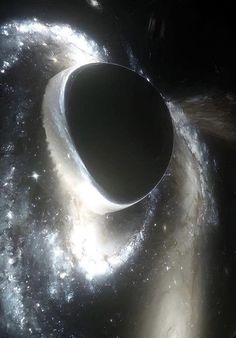 an artist's impression of a black hole in space