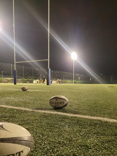 a football sitting on top of a lush green field