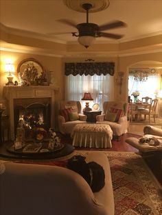 a living room filled with furniture and a fire place