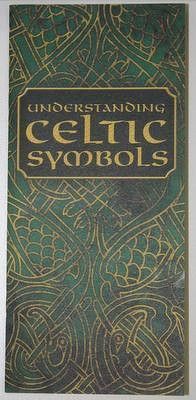 an old book with celtic symbols on the front and back cover, in gold lettering