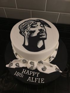 a birthday cake decorated with an image of a woman's face