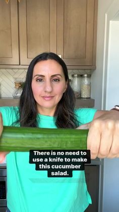 a woman holding up a cucumber with a quote on the front saying there is no need to use kiwis to make this salad