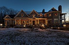 a large house with christmas lights on it