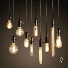 the light bulbs are hanging from the ceiling and have been turned on by different types of lights