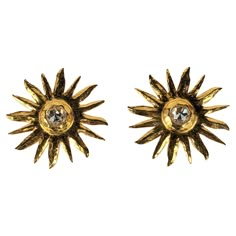 Striking Yves Saint Laurent Hammered Gold Sunburst Earrings from the late 1980's. Made by Maison Goossens with a rose cut crystal at center. Light in weight but large in scale. 2.5" across. YSL Rive Gauche. Clip back fittings. Matching Brooch available. Sunburst Jewelry, F1 Fits, Yves Laurent, Sunburst Earrings, Ysl Rive Gauche, Gold Sunburst, Golden Earrings, Chanel Vintage, Rive Gauche