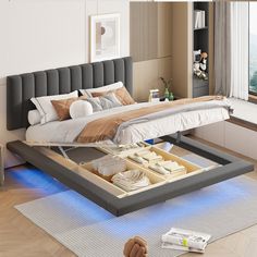 a bed that is sitting in the middle of a room with a light underneath it