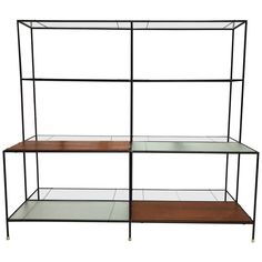 three tiered shelving unit with glass shelves on each side and wood bottom shelf