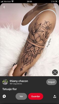 a woman's arm with tattoos on it