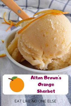 an orange ice cream in a white bowl