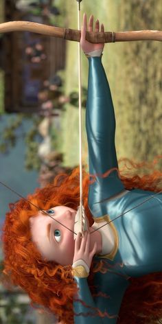 a woman with red hair is hanging upside down on a pole and holding onto a stick