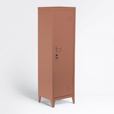 a tall brown metal locker sitting on top of a white floor