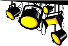 three black and yellow spotlights hanging from a ceiling with wires attached to it's sides