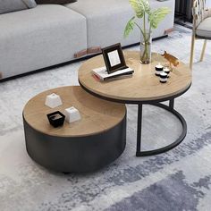 two coffee tables sitting next to each other on top of a rug