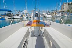 the front end of a sailboat docked at a marina