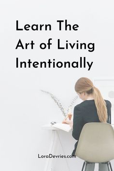 a woman sitting at a desk writing with the words learn the art of living internationally