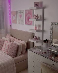 a bedroom with pink and white decor in it