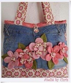 a denim purse with pink flowers on it