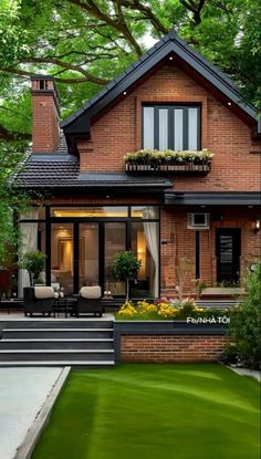 a house that is surrounded by trees and grass