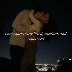 a man and woman kissing in front of a cityscape with the words i am constantly loved, cherished, and romance