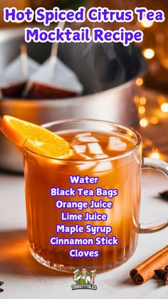 hot spiced citrus tea cocktail recipe in a mug with an orange slice on top