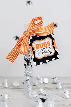 a bottle filled with candy sitting on top of a table