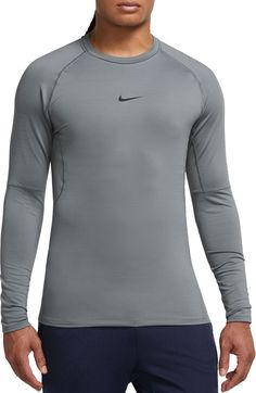 Fit & Design: Long sleeves Crewneck Rounded hem gives you extra coverage for your stretching routines and all your multi-direction movements Added length helps the top stay tucked in Mesh panels on the back and under the arms add ventilation and keep you cool French terry fabric has stretch for a body-hugging feel and provides smooth warmth Technology: Nike Dri-FIT technology moves sweat away from your skin for quicker evaporation, helping you stay dry and comfortable Fitted Technical Gray Tops, Nike Gray Stretch Top, Nike Fitted Functional Activewear, Nike Stretch Tops For Light Sports, Nike Fitted Functional Tops, Nike Fitted Tops, Nike Stretch Technical Activewear, Nike Technical Stretch Activewear, Technical Nike Activewear