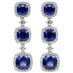 This extravagant dangle drop earrings features a row of cushion cut blue sapphires weighing 4.51 carats total, each set in a brilliant diamond halo. Diamonds weigh 0.73 carats total. Made in 18k white gold. Roman Malakov is a custom house, specializing in creating anything you can imagine. If you would like to receive a special quote on a custom piece please message or call us. Sapphire Diamond Earrings, Blue Diamond Earrings, Cushion Cut Halo, Abed Mahfouz, Sapphire And Diamond Earrings, Jewellery Sketches, Halloween Painting, Exclusive Jewelry, Ear Rings