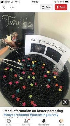 a black tray with stars on it next to a card and some other items in the background