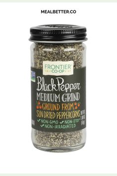 a glass jar filled with black pepper