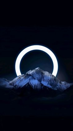 an eclipse in the night sky over mountains