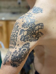 a man with a tattoo on his arm