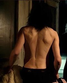 the back of a man with no shirt on