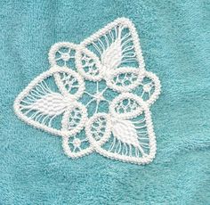 a towel with an embroidered applique on it