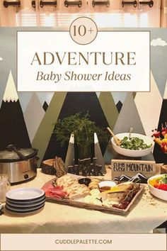 a baby shower table with food on it and the words 10 adventure baby shower ideas