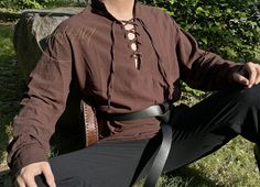 Brown Medieval Viking Tunic, Renaissance Pirate Shirt, Ren Faire Costume LARP Tunic Shirt, Long Sleeve Cotton Linen Men Tunic Elevate your wardrobe with our Viking Medieval Men's Linen Tunic, expertly crafted for a perfect fusion of historical charm and contemporary comfort. Ideal for those seeking a unique and stylish nod to the past. Elevate your wardrobe with our Viking Medieval Men's Linen Tunic, expertly crafted for a perfect fusion of historical charm and contemporary comfort. Ideal for th Medieval Casual Clothes, Casual Medieval Outfits Men, Bohemian Long Sleeve Tops For Larp, Traditional Long Sleeve Tops For Larp, Ren Faire Masc, Nonbinary Ren Faire, Casual Pirate Outfit, Mens Ren Faire Outfit, Egypt Clothing