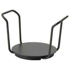 a black metal object with two handles on the front and back ends, sitting on a white background