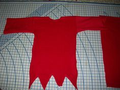 the red shirt is cut out and ready to be sewn on it's side