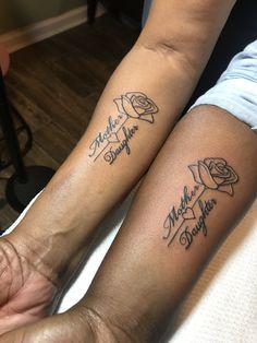 two people with matching tattoos on their arms