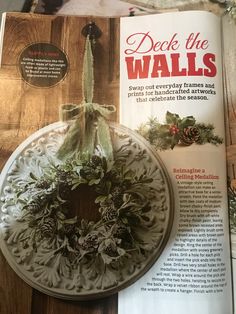 an article in the december issue of deck the walls featuring a wreath and pine cones