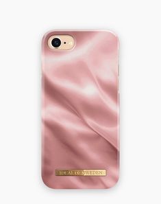 a pink phone case with gold foil on it