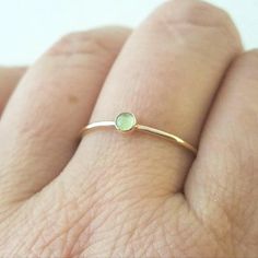 18 Gold Peridot Ring Gold Stackable Rings With Peridot Birthstone, Minimalist Gold Emerald Birthstone Ring, Gold Peridot Stackable Rings As Gift, Gold Stackable Peridot Rings As A Gift, Dainty Green Birthstone Ring In 14k Gold, Dainty Green Birthstone Ring With Gemstone, Dainty Green 14k Gold Stackable Rings, Green Birthstone Ring For Everyday Wear, Green Birthstone Ring For Everyday