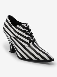 Bring some of that old-timey edge to your shoe rotation with this Strange Cvlt pair. Called the Victoria heels  they're inspired by the Victorian era and are black-and-white striped.Listed in women's sizes.3" heelPolyurethane upper; rubber soleImported Carrie White Costume Shoes, Black White Bottom Shoes, Closed Toe Black Wedge Sandals, Hot Topic Shoes, Black And White Heels, Pointy Heels, Vintage Heels, London Shoes, Black And White Stripes