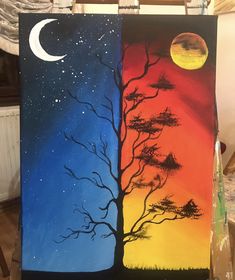 two canvases with trees and the moon painted on them