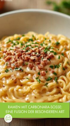 a white bowl filled with pasta covered in sauce